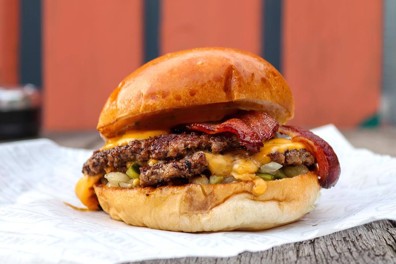 smashed beef patty burger with cheese, and bacon test kitchen