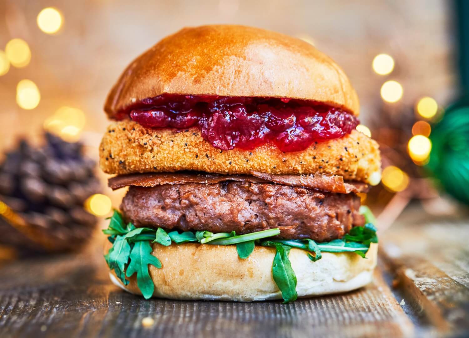 Christmas veggie beyond meat burger with deep fried camembert cheese and bacon