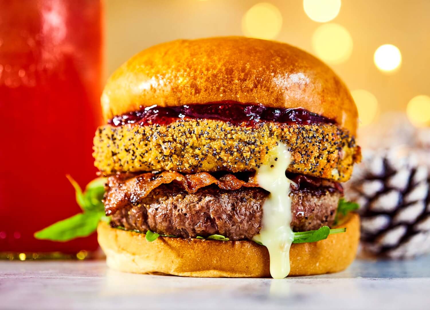 beef burger with deep fried camembert and cranberry sauce